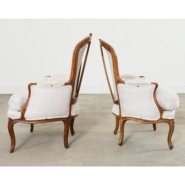 Early 20th Century Pair of French Louis XV Style Walnut Bergeres With Linen For Sale - Image 5 of 18