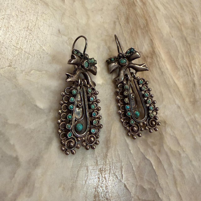 For your consideration vintage Mexican American style dangle earrings, likely featuring sterling silver and turquoise...