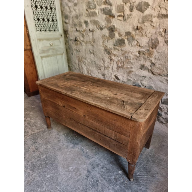 French oak coffer bench dating from the late 18th to early 19th century. Constructed from solid oak, the piece stands on...