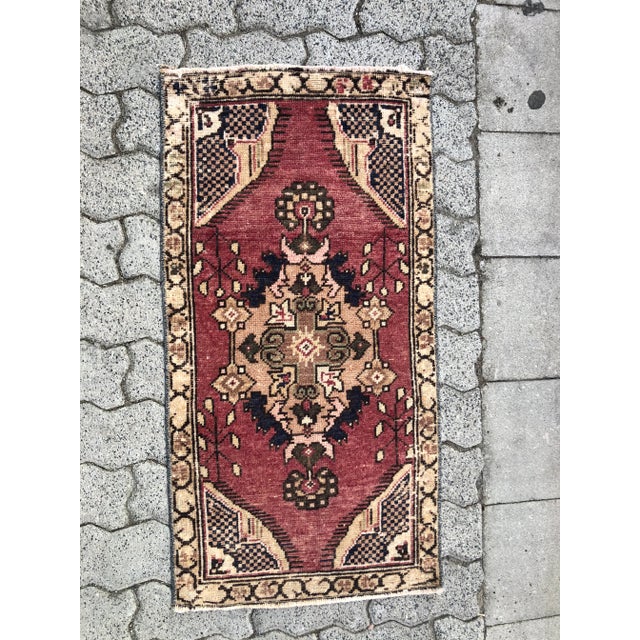 This is a vintage Turkish Oushak rug from the 1960s. The piece was hand-knotted.