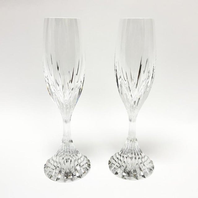 This elegant pair of Baccarat Massena champagne flutes features finely blown crystal with classic vertical cuts that rise...