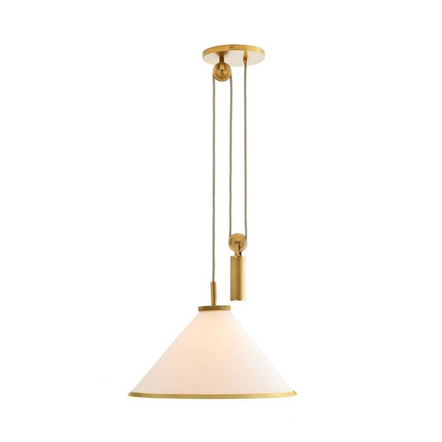 The Norfolk is a finely crafted counterweight pendant with a contemporary, clean-lined profile crafted with a white linen...