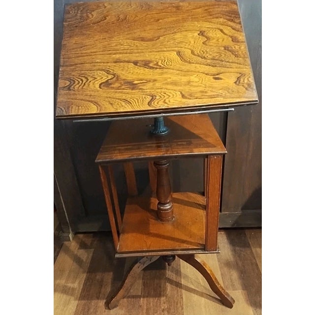 Unique solid wood book display/music stand Nice medium wood tone adjusts and swivels top adjusts to lay flat or at an...