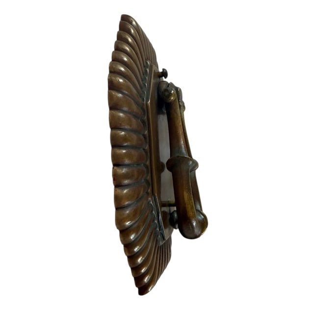 Incredible bronze door knocker has original patina with a slight verdigris. A statement piece of hardware that will make...