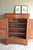 of a 19th-century French oak Louis Philippe maid's cabinet. The height is 148 cm. The width is 107 cm. The depth is 45 cm....