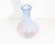 A glass vase produced by Dansk. The vase features a blue and orange spiraled pinstripe design.