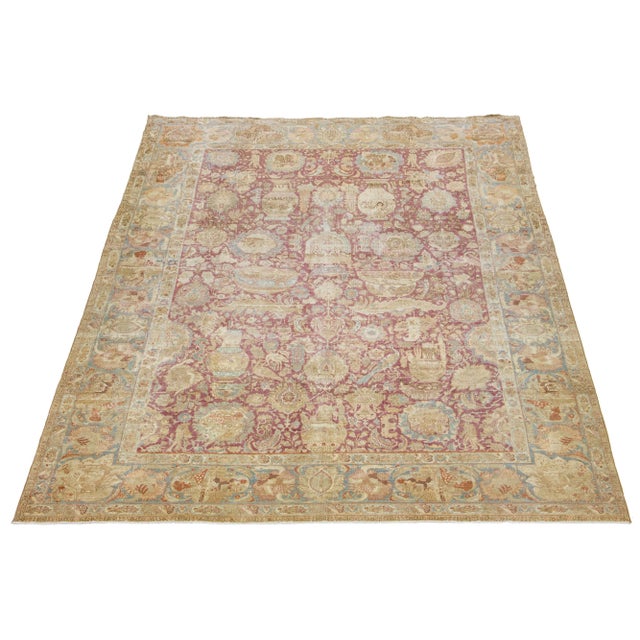 The Persian Tabriz wool rug is handcrafted and showcases a beautiful traditional floral pattern. The alluring contrast...