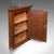 This is an antique corner cupboard. An English, oak and pine wall cabinet in Chippendale revival taste, dating to the...