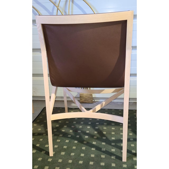 Armchair in solid natural ash and leather, one of Cassina's creations which is more technically complex to achieve due to...