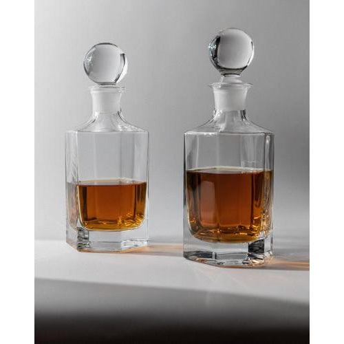 This vintage 1970s glass decanter set of 2 is crafted in elegant hexagonal clear glass, combining geometric precision with...