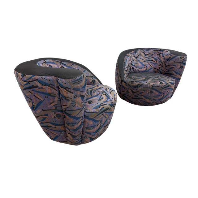 Make a bold statement with this eye-catching pair of vintage 1990s Weiman-style swivel lounge chairs. Featuring their...