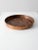 An antique molded copper escargot pan featuring a classic round form with seven evenly spaced indentations designed for...