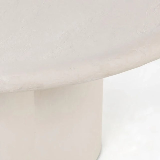 Crisp, clean adobe vibes. Made from white-finished concrete, a voluminous clover-shaped base supports a thick-rounded...