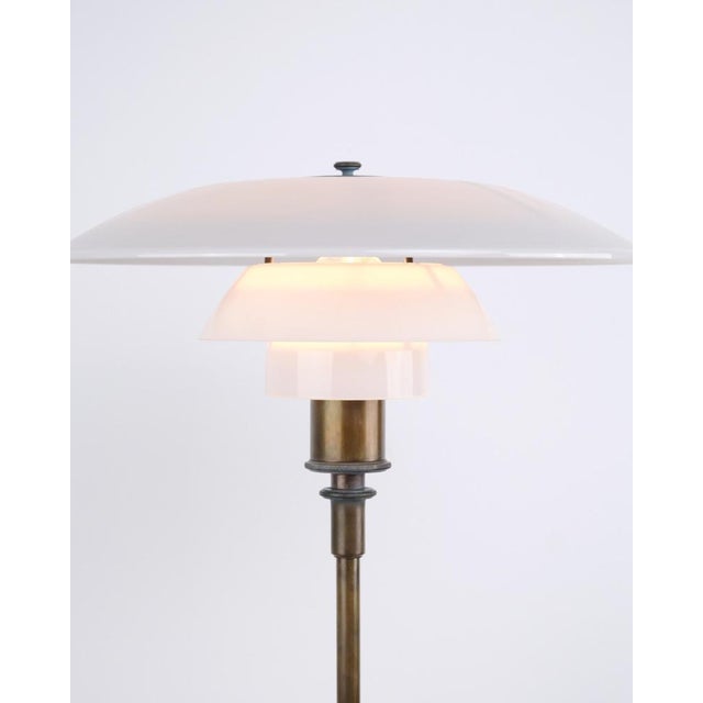 Ph 4/3 table lamp designed by poul henningsen and produced by louis poulsen in the 1930s. The lamp is made of burnished...