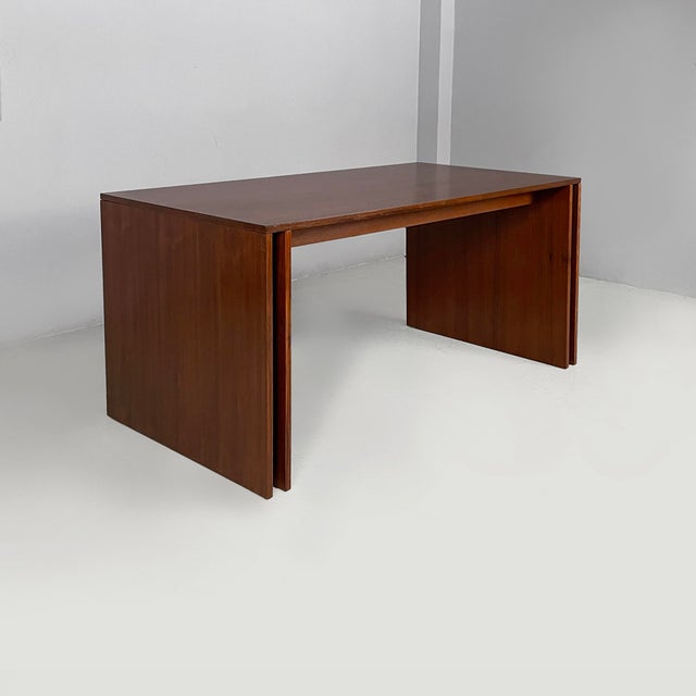 Italian modern extendable wood dining table by Poggi, 1970s Extendable dining table made entirely of wood. The extension...