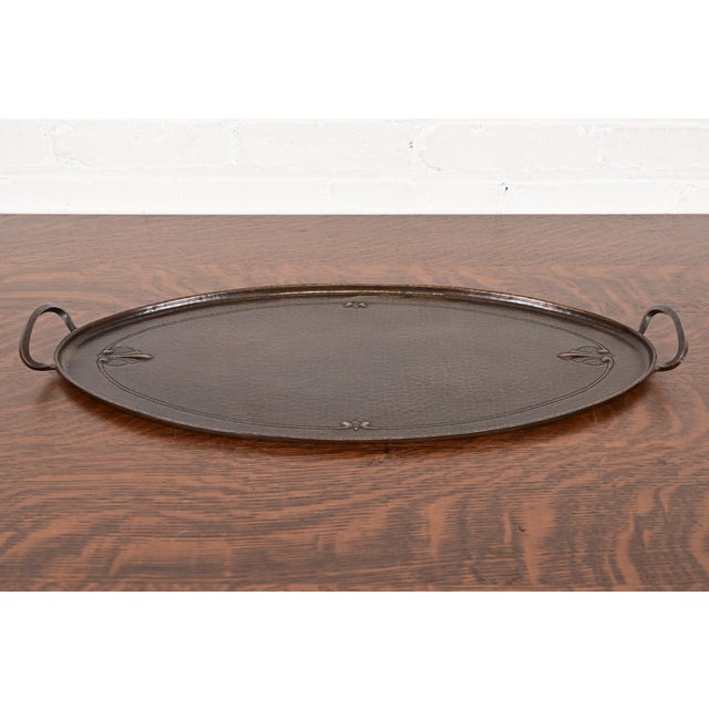 A gorgeous Arts & Crafts period hand hammered copper tray with handles By Roycroft (signed with impressed orb and cross...