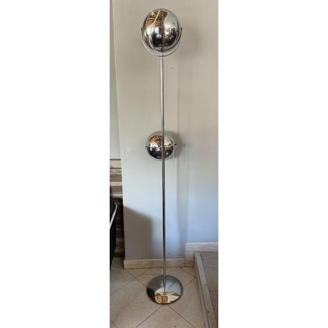 Reggiani branded lamp. Features 2 spherical diffusers. In good condition, obviously with signs of aging visible in the...