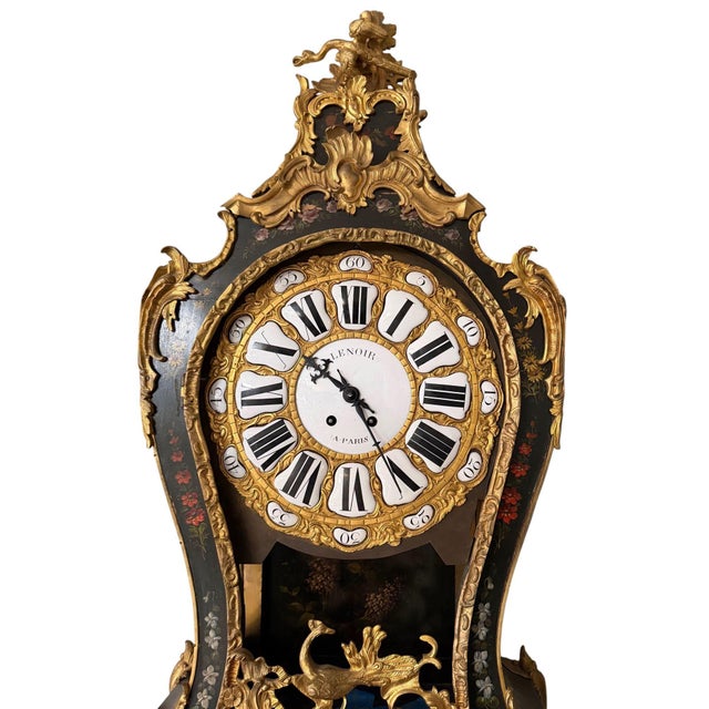 An extraordinary and highly decorative French Louis XV style cartel wall clock with matching bracket, bearing the...