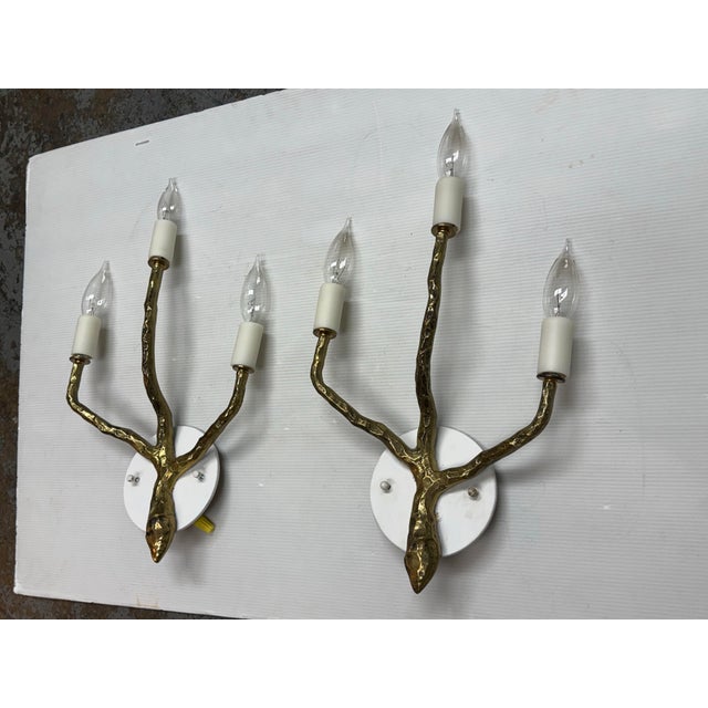 Design Plus Gallery presents a Pair of Maison Arlus Style Wall Sconces. This pair offers a sculptural branch form in a...