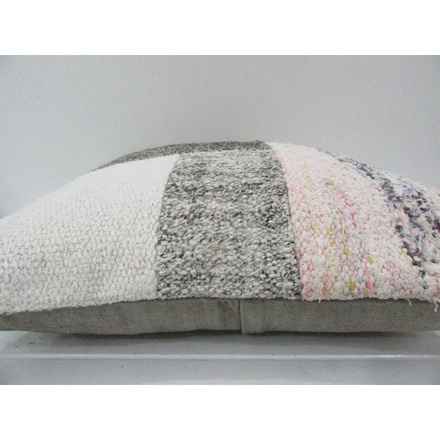 This is a pillow cover made from a vintage kilim rug. The piece was properly washed and ready to use. Pillow inserts not...