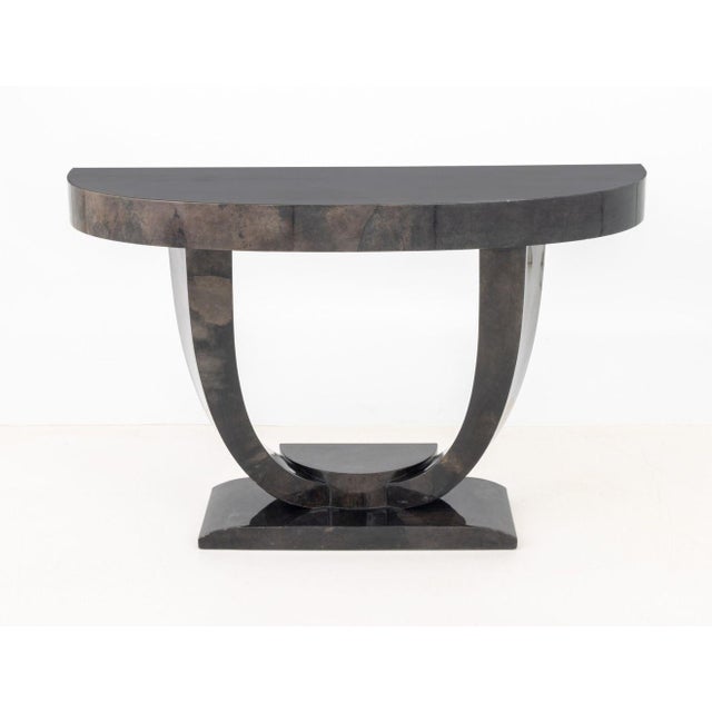 Karl Springer Goatskin Lacquered Console Table, in black with geometric base. 34" H x 54" W x 18" D. Provenance: From a...