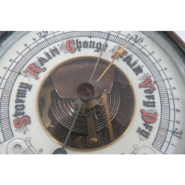 This gorgeous Aneroid Barometer was made in Germany, and is marked as such on the front. This wonderful weather instrument...