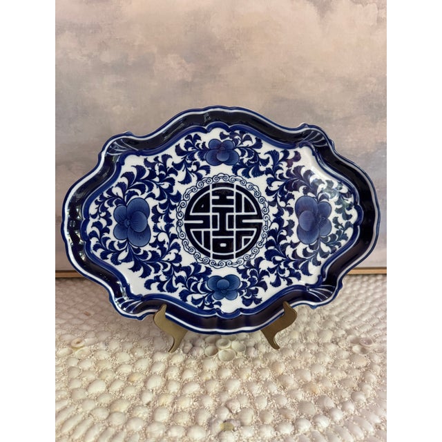 A beautiful blue and white porcelain tray by the Bombay Company, perfect for corralling things on your vanity or...
