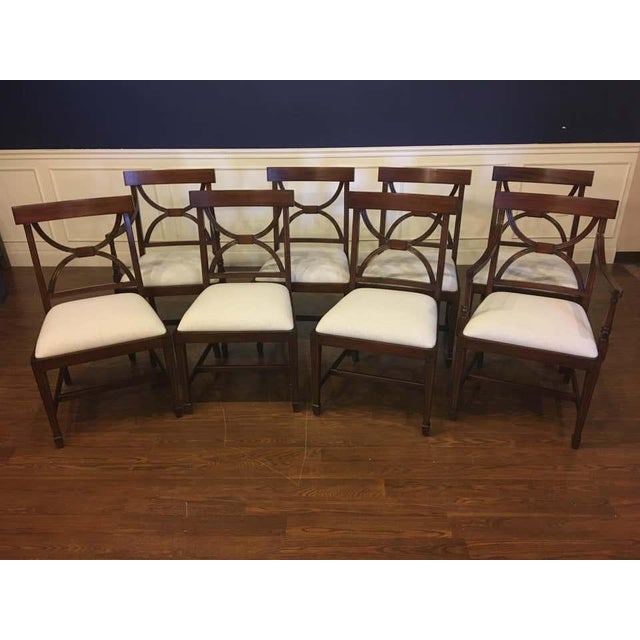 This is a set of eight (2 arms and 6 sides) traditional mahogany Adams style dining chairs by Leighton Hall. Their design...