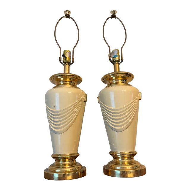 Vintage Hollywood Regency Brass & Cream Ceramic Drape Table Lamps - A Pair For Sale