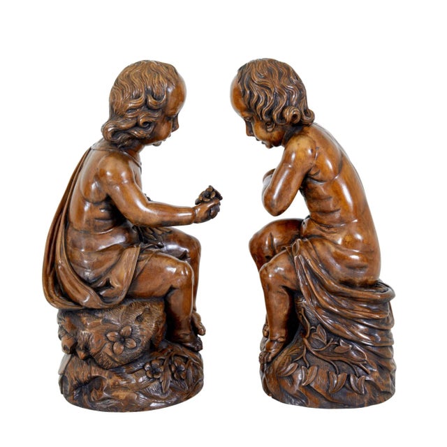 Pair of gothic revival carved cherubs circa 1970. Good quality pair of hardwood cherubs which are coloured to match...
