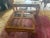 Stunning chinoiserie chow leg Ming style square coffee table with four beveled smoke glass inserts and burl wood inlays!...