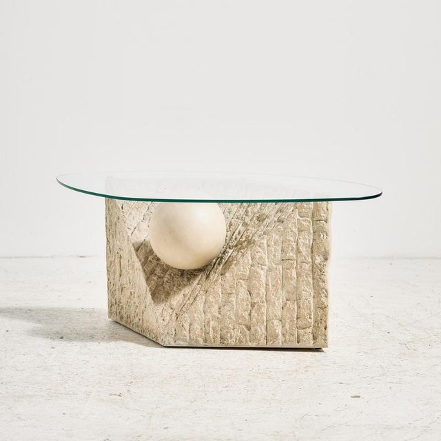 Fiberglass coffee table from the 1980s. The base of the coffee table features sculptural forms and is fitted with a glass...
