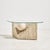 Fiberglass coffee table from the 1980s. The base of the coffee table features sculptural forms and is fitted with a glass...