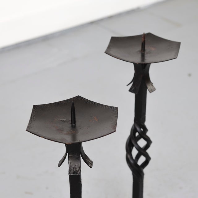 Set of two brutalist candlesticks from the 1970s, crafted from twisted iron in a style typical of the period. Beautiful as...