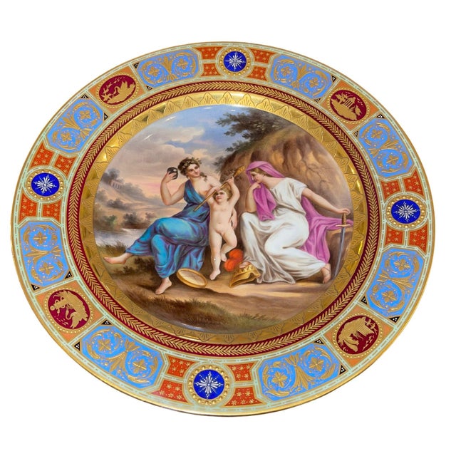 An exceptional pair of 19th century Royal Vienna porcelain cabinet plates, each finely hand-painted with classical...