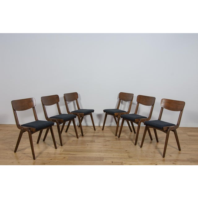Set of 6 Polish dining chairs model Boomerang 229XB from Gościcińskie Furniture Factory in the 1960s. The frame of the...