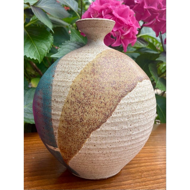 Stunning hand-thrown stoneware “moon” or orb vase, also called a “weed pot”. This piece features a striking modernist...