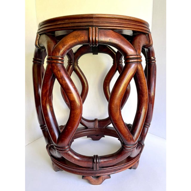 Here is a gorgeous Chinese drum stool made from hardwood/rosewood and featuring an incredible interwoven, rope-like carved...