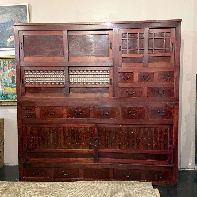 An exceptional, large-scale antique Japanese mizuya-dansu (kitchen/pantry cabinet), dating to the Meiji–Taisho period...