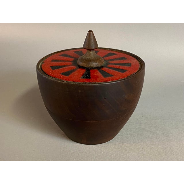 Hand turned walnut and enameled covered vessel. It still retains its BIG red label on the bottom, Capital Enterprise...