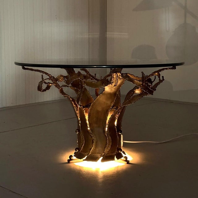 Very special coffee / side table in the style of Silas Seandel / Paul Mierenhout. Brutalist shaped dark brass table with...