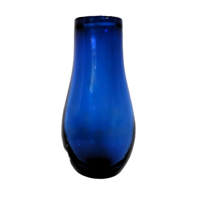 I just love the look of cobalt blue glass. This blown glass vase is 9" tall and 4" wide. No damage as in cracks or chips....