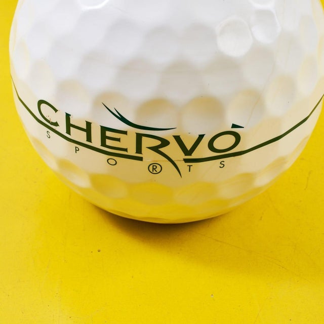 Discover a unique piece of contemporary design with this golf ball-shaped vase, perfect for lovers of golf and innovative...