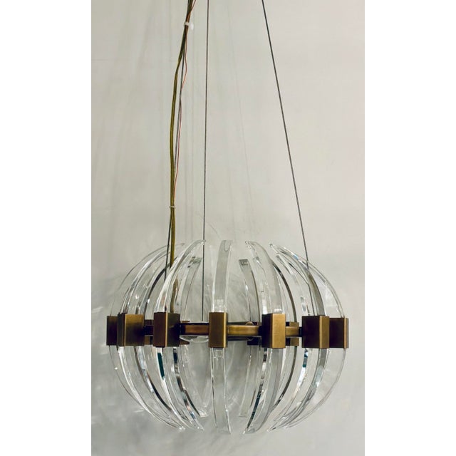 Original retail $2640, stylish Currey & Company Modern Small Brass and Glass Coquette Chandelier, showroom floor sample