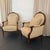 This is a pair of walnut Louis XVI-style bergère armchairs produced circa the 1950s. The chairs combine classical European...