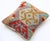 A one-of-a-kind handwoven Afghan wool kilim accent pillow featuring snowflake medallion patchwork. Cut and sewn by hand...