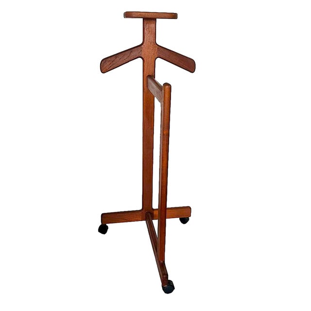 Offered is an early 1970s Teak wood valet designed by Johannes Sorth for Bornholm Møbelfabrik, made in Denmark. It...