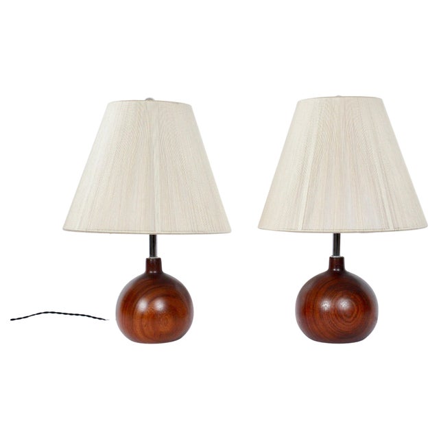Pair of Danish Modern ESA style dark solid teak table lamps, 1970's. Featuring finely grained, staved Dark Teak globe...