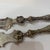antique silver-plated fish serving set, featuring a large ornate fork and an engraved slice/knife with scrolled handles...