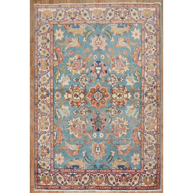 A set of Persian Tabriz scatter-size rugs from the early 20th Century. One is more faded and lighter than the other....